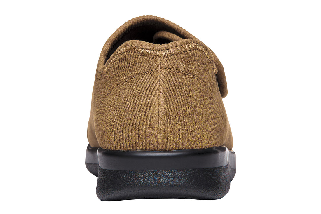 Shoe, black rubber chevron sole, cushioned footbed, Propet logo centered.