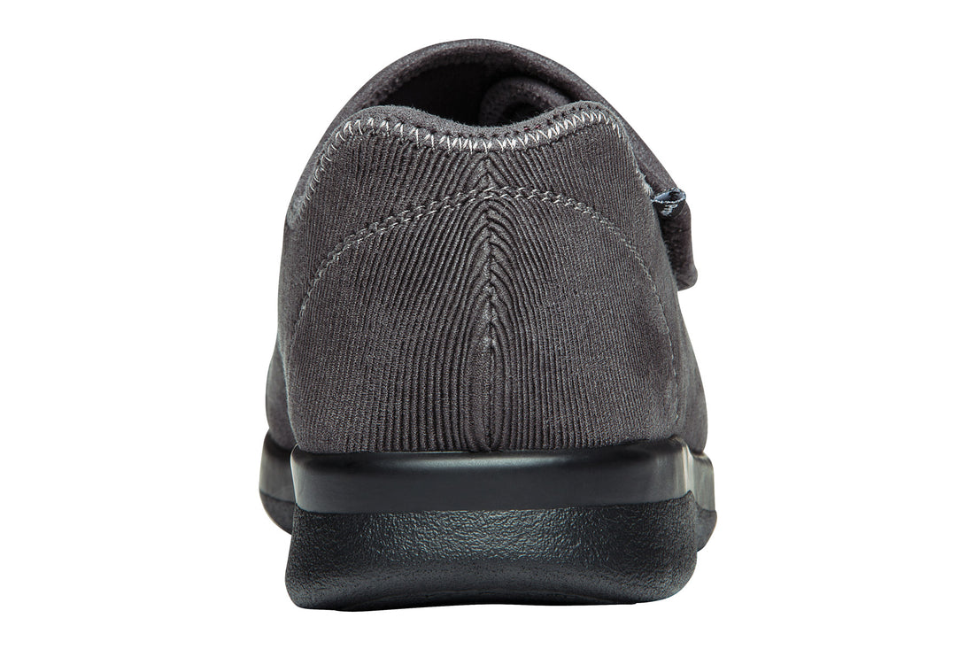 Shoe with black rubber sole, zigzag tread, cushioned footbed; Propet Cush N Foot logo at center.