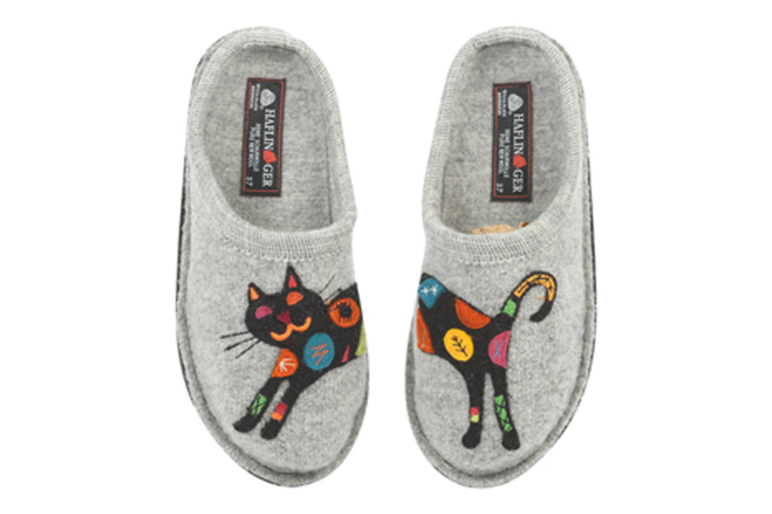 Slippers in gray wool by Haflinger Sassy with colorful cat design, cushioned footbed, shown on white background.