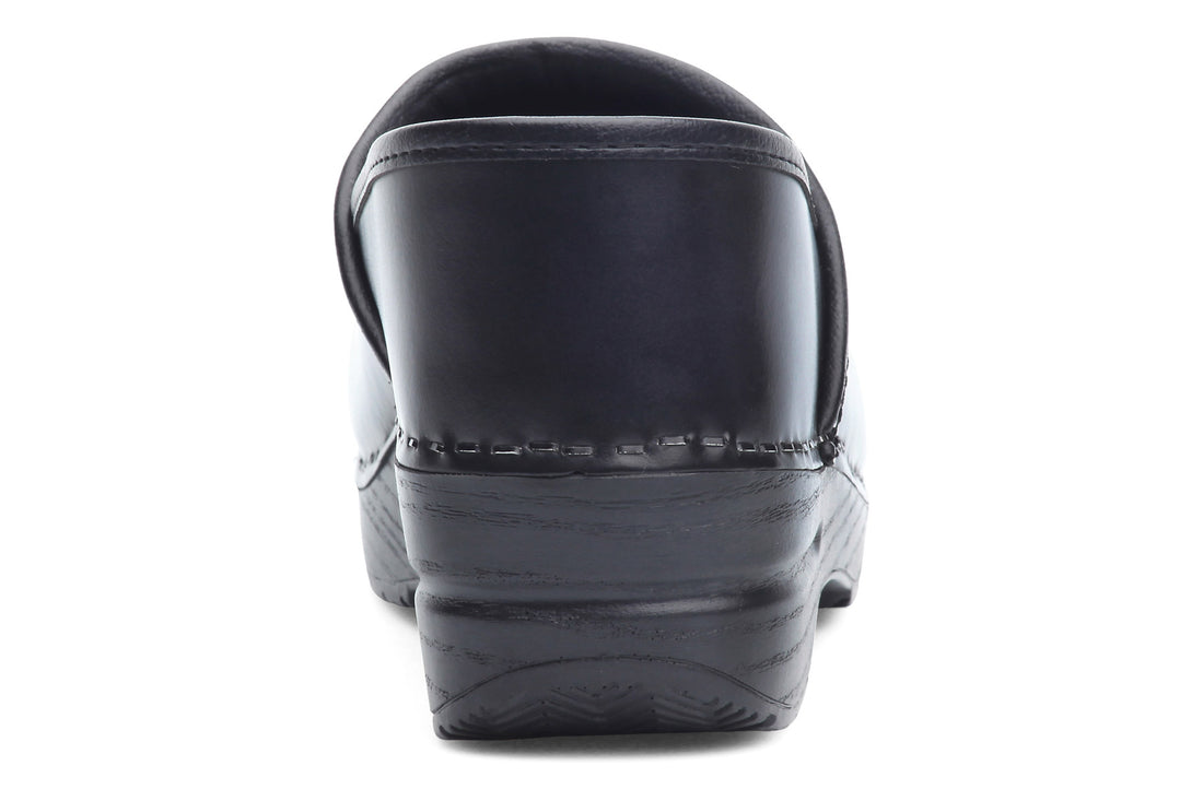 Clog, black leather Dansko Professional, rear view with visible stitching, contoured footbed, and textured sole.