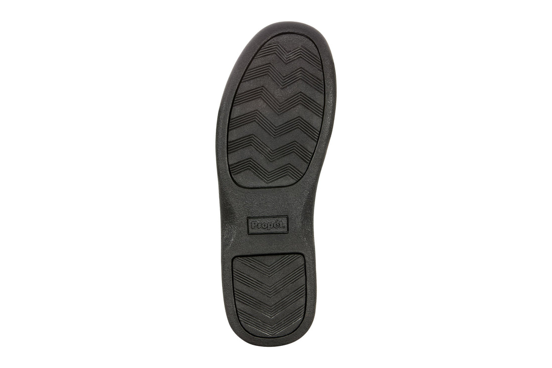 Shoe, black rubber chevron sole, cushioned footbed, Propet logo centered.