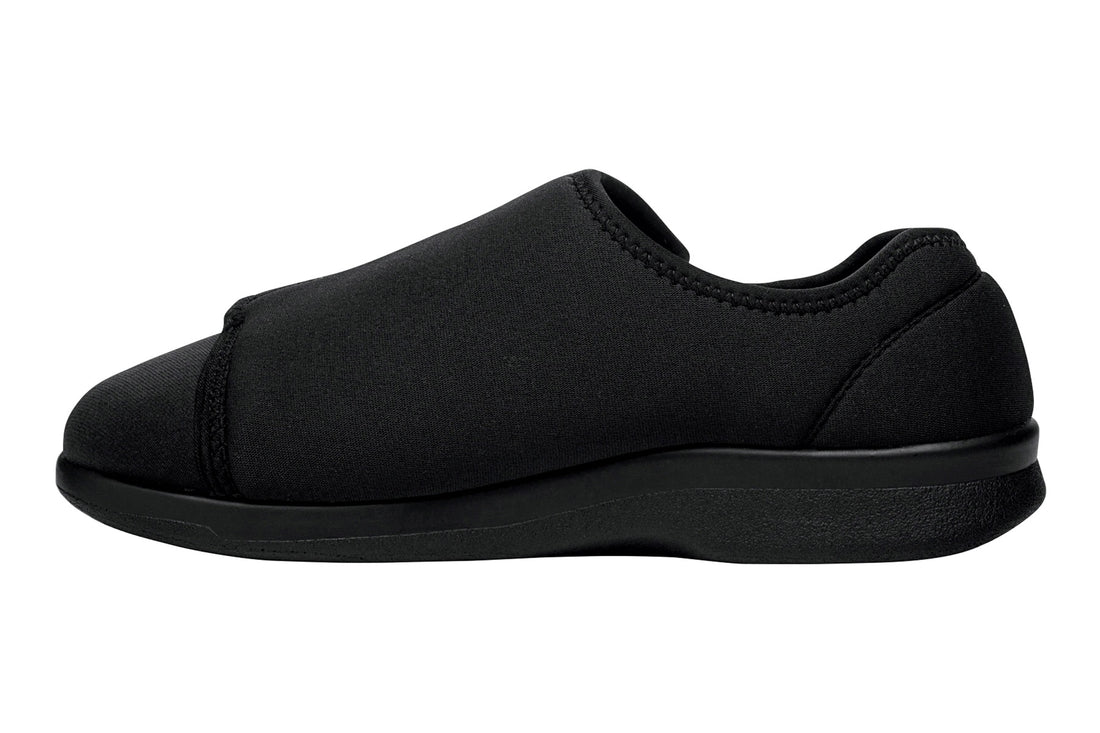 Shoe with black chevron rubber sole, Propet logo, for Cush N Foot slippers; features removable insoles for comfort.