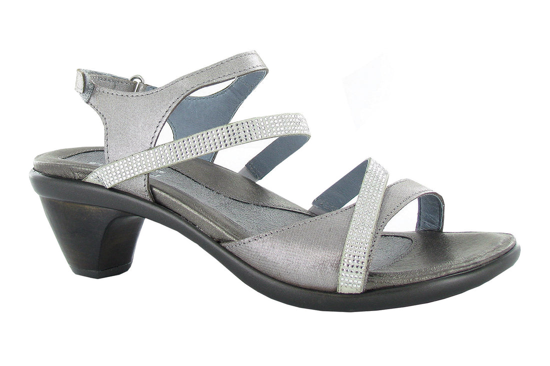 Sandal, silver leather, with multiple straps and closed heel by Naot Innovate, shown on white. Comfort footbed not visible.